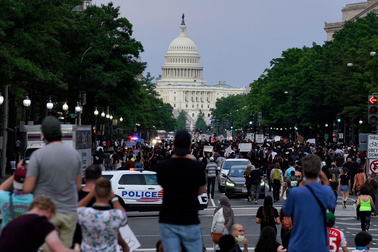 Demonstrators walk along Pennsylvania Avenue in Washington, DC, on May 29.