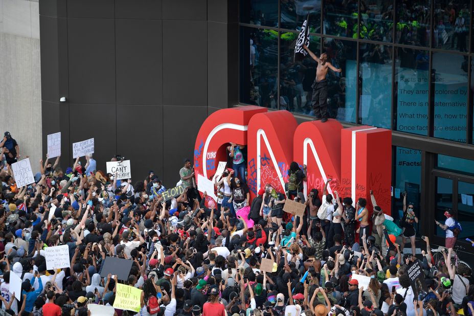 Demonstrators protest outside CNN headquarters in Atlanta on May 29.