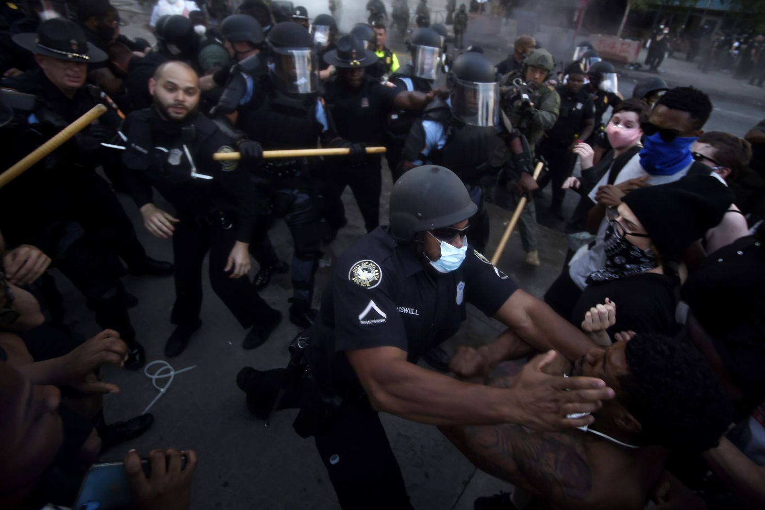 Police officers and protesters clash near the CNN Center in Atlanta on May 29.