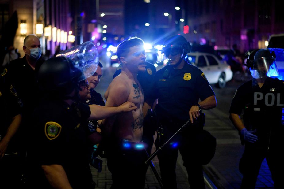 A protester is detained by police in Houston on May 29.