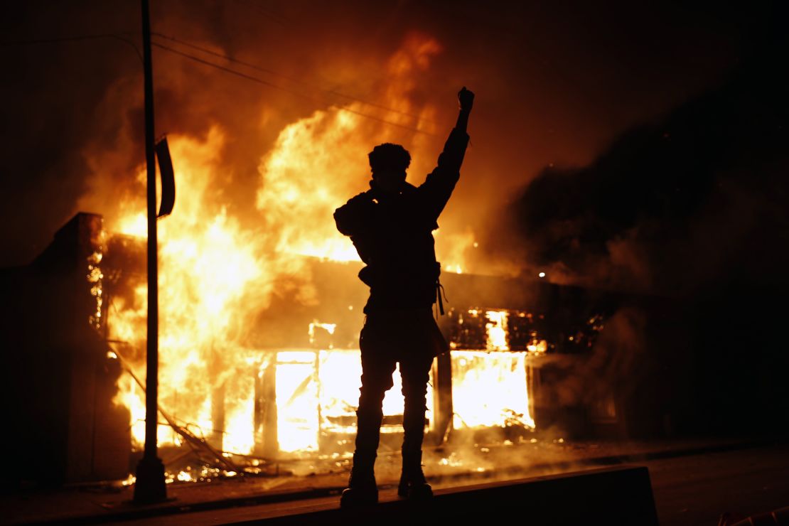 A check-cashing business burns during protests in Minneapolis on May 29, 2020.