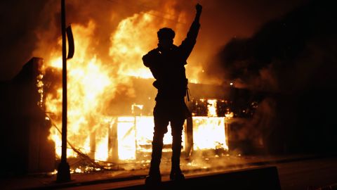 A check-cashing business burns during protests in Minneapolis on May 29, 2020.