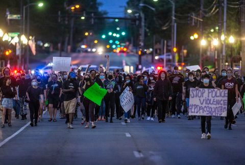 Protesters walk through downtown Lexington, Kentucky, on May 29.