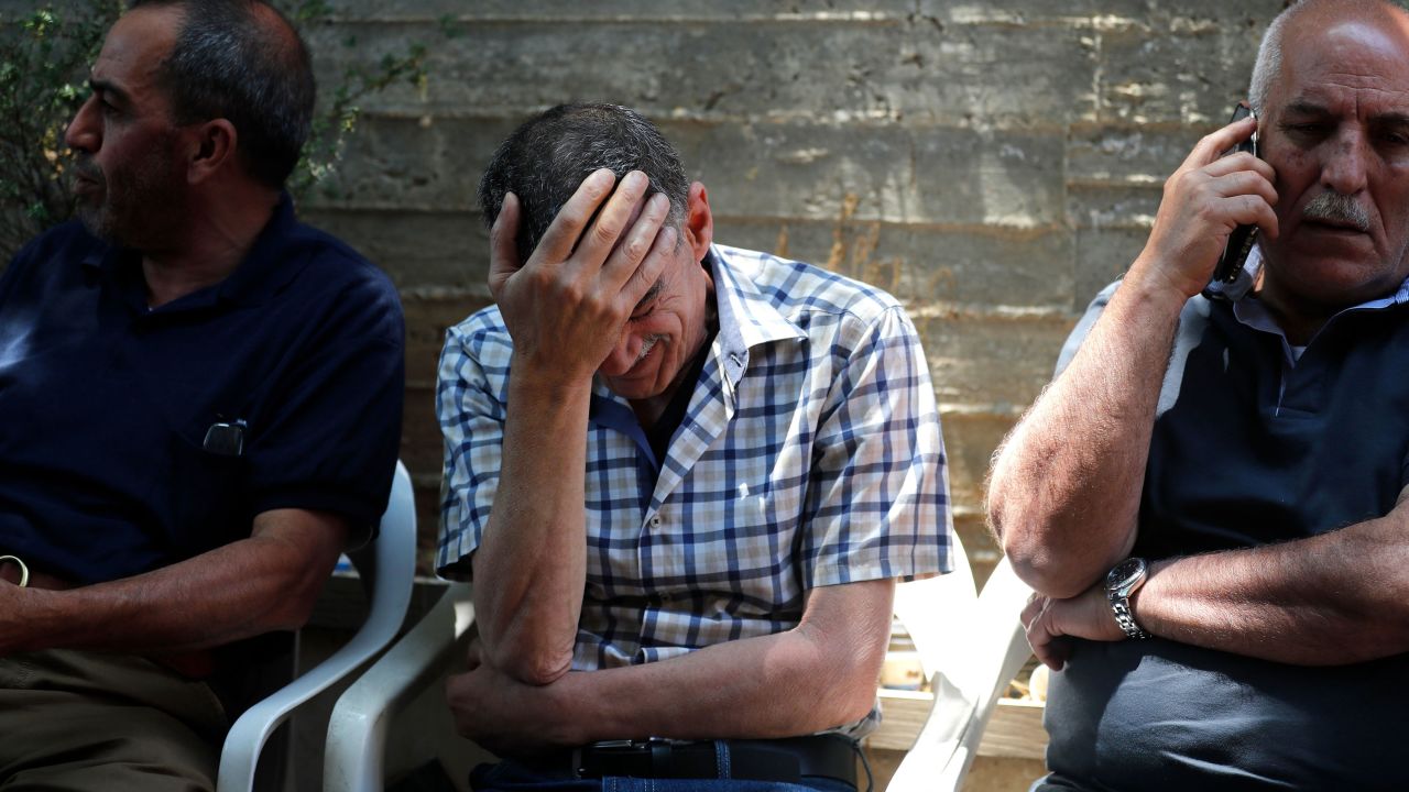 The father of Eyad Rawhi Al-Halaq mourns his son's death.