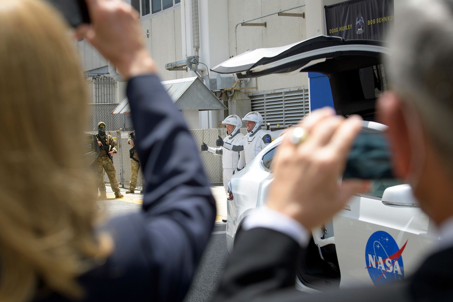 Hurley and Behnken walk out of the Neil Armstrong Operations and Checkout Building on May 30.