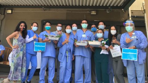 Healthcare workers at the Straub Medical Center with the donated tuna poke bowls.