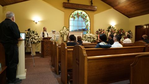 The closest members of Guadalupe Ortiz-Sandoval's family celebrate her life at McKenzie Mortuary in Long Beach, California, while the ceremony is broadcast to extended family and friends online.