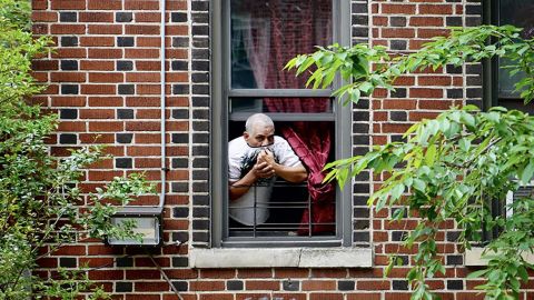 Neighbors kept their distance, paying their respect to Carlos and Lordes Coronal from their apartment windows, as the van carrying the two coffins stopped in front of the family home in Brooklyn, New York.