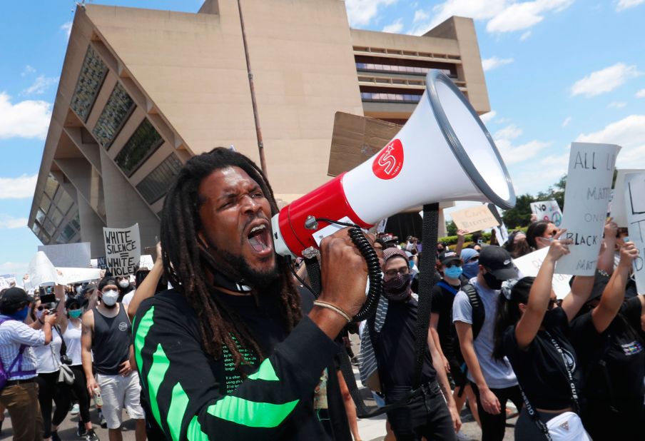 Protesters chant outside Dallas City Hall on May 30.