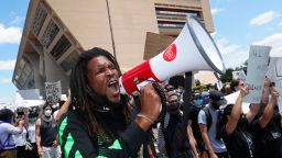 Protesters chant in front of Dallas City Hall in downtown Dallas, Saturday, May 30, 2020. Protests across the country have escalated over the death of George Floyd who died after being restrained by Minneapolis police officers on Memorial Day. 