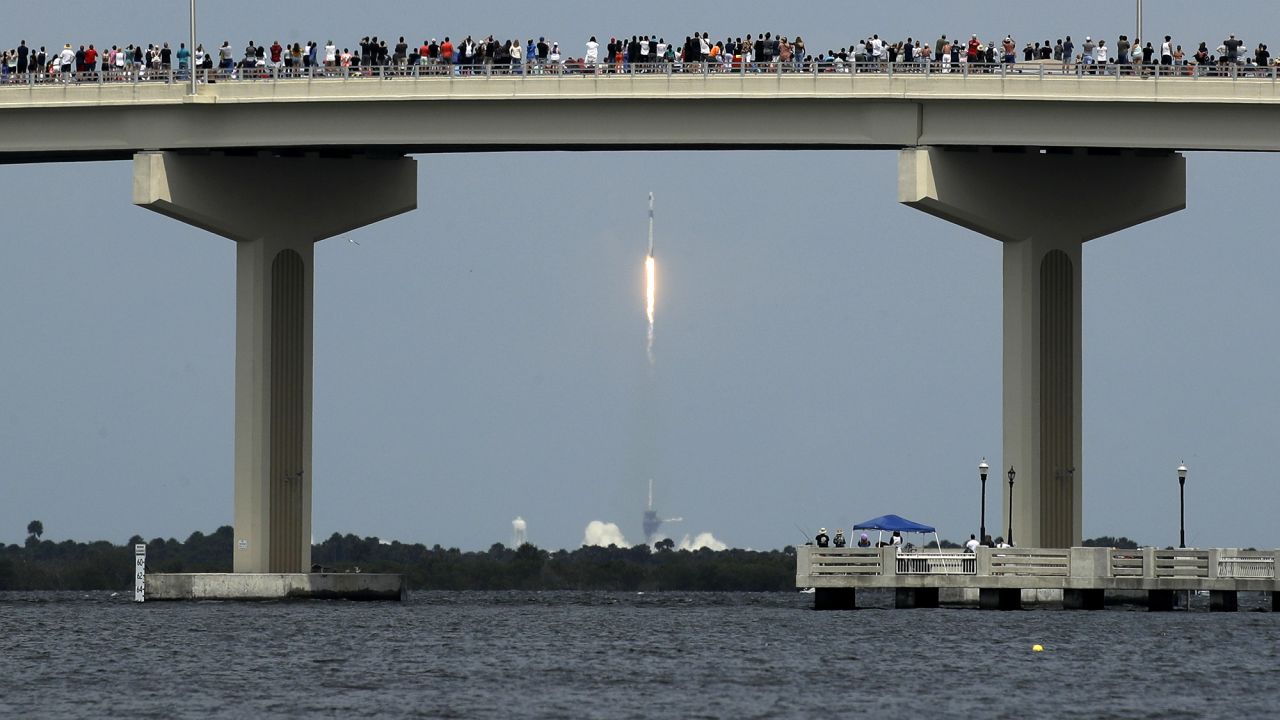 Spectators watch the SpaceX launch from a bridge in Titusville, Florida, on May 30.