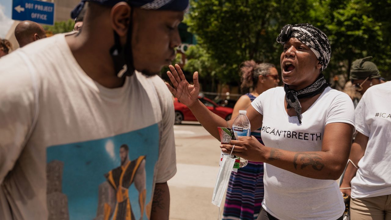 Eva Harris speaks to a crowd of people during a protest in downtown Atlanta on Saturday, May 30.  