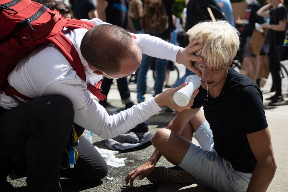 A protester receives first aid after being hit with pepper spray outside the Statehouse in Columbus, Ohio, on May 30.