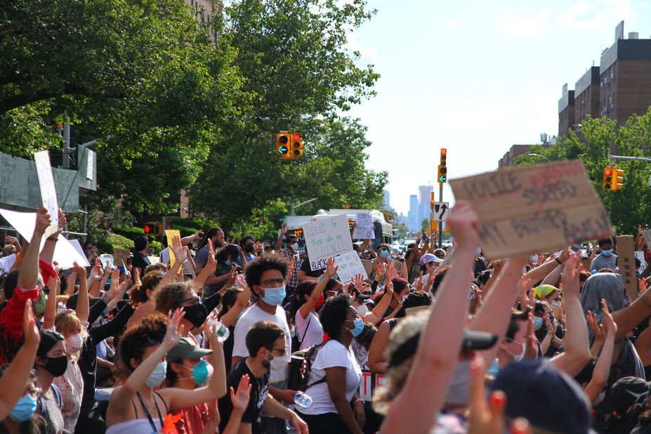 Protesters begin to kneel during a protest in New York's Queens borough on May 30.