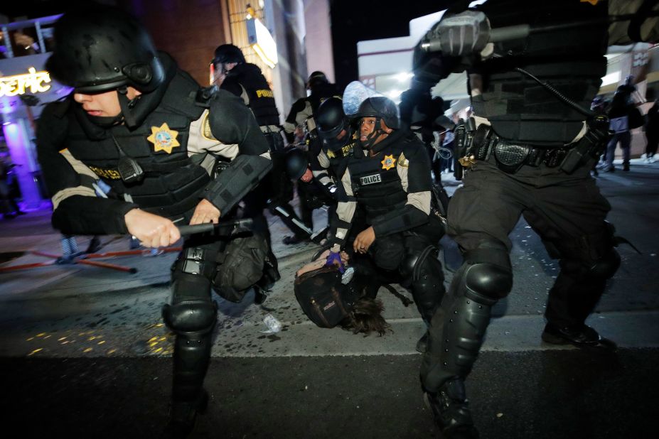 Police push people back as they detain a protester in Las Vegas on May 30.