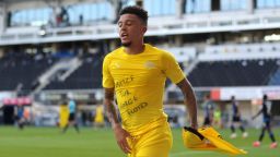 Jadon Sancho of Borussia Dortmund celebrates scoring his team's second goal of the game with a 'Justice for George Floyd' t-shirt during 6-1 Bundesliga win over SC Paderborn.