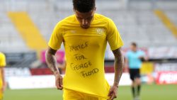 Dortmund's English midfielder Jadon Sancho shows a "Justice for George Floyd" shirt as he celebrates after scoring his team's second goal during the German first division Bundesliga football match SC Paderborn 07 and Borussia Dortmund at Benteler Arena in Paderborn on May 31, 2020.