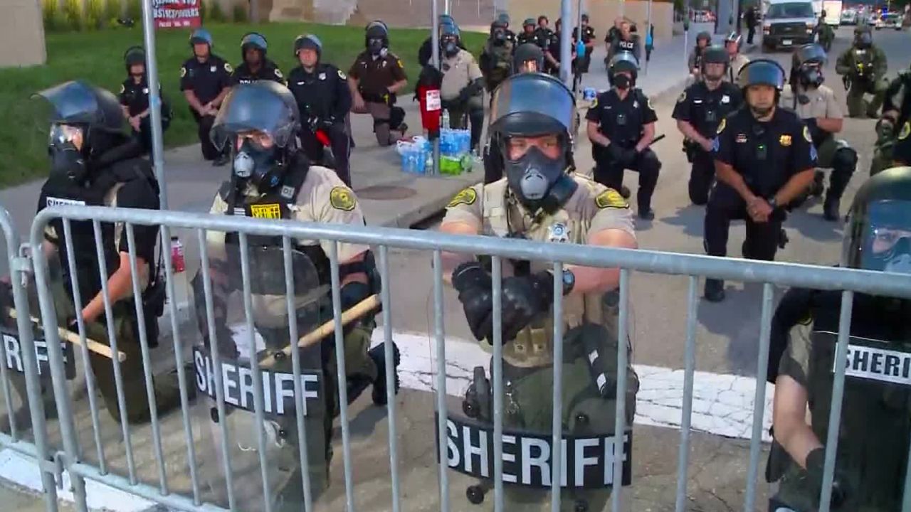 Des Moines law enforcement took a knee outside of the Des Moines Police Department with protesters in solidarity.