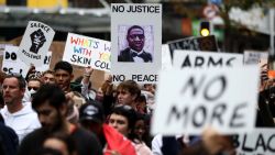 AUCKLAND, NEW ZEALAND - JUNE 01: Protestors march down Queen Street on June 01, 2020 in Auckland, New Zealand. The rally was organised in solidarity with protests across the United States following the killing of an unarmed black man George Floyd at the hands of a police officer in Minneapolis, Minnesota.  (Photo by Hannah Peters/Getty Images)
