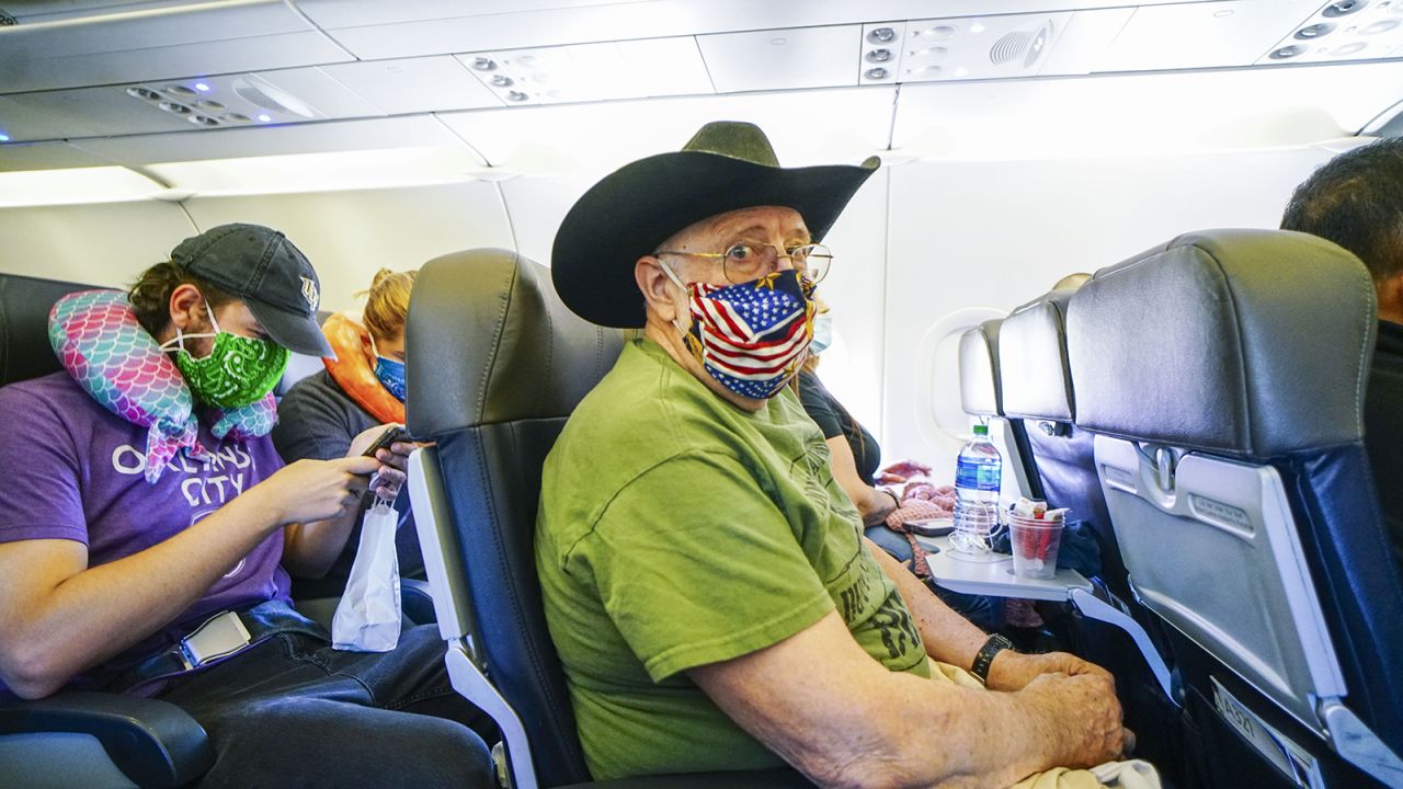 SAN DIEGO, CA - MAY 20: Passengers onboard an American Airlines flight to Charlotte, NC at San Diego International Airport on May 20, 2020 in San Diego, California. Air travel is down as estimated 94 percent due to the coronavirus (COVID-19) pandemic, causing U.S. airlines to take a major financial hit with losses of $350 million to $400 million a day and nearly half of major carriers airplanes are sitting idle. (Photo by Sandy Huffaker/Getty Images)