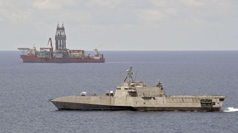 The littoral combat ship USS Gabrielle Giffords conducts routine operations near the Panamanian flagged drill ship, West Capella, May 12, 2020, the South China Sea.