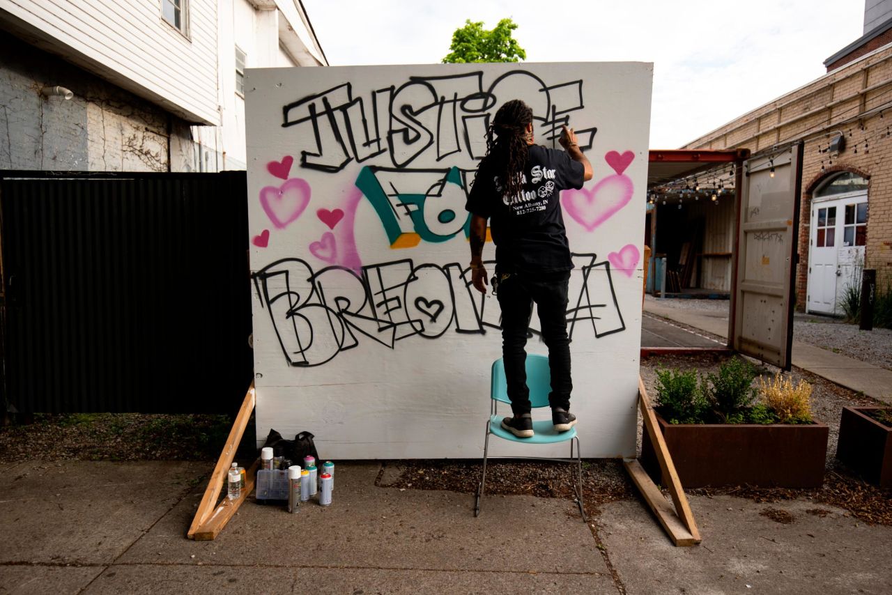 Grafitti artist Resko paints a mural near where a march started on May 29, 2020 in Louisville, Kentucky. Protests have erupted after recent police-related incidents resulting in the deaths of African-Americans Breonna Taylor in Louisville and George Floyd in Minneapolis, Minnesota. 