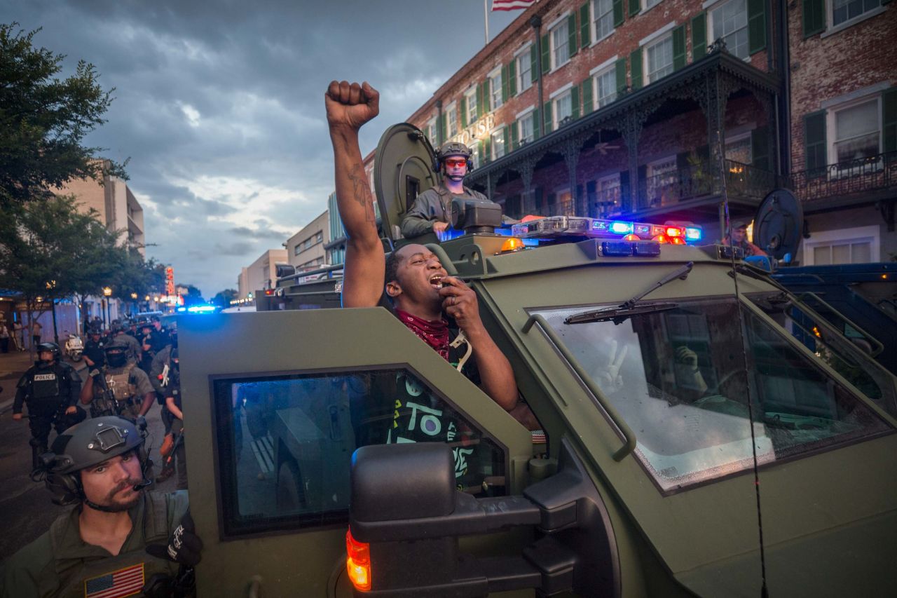 Protester Kendrick Cutkelvin uses a SWAT vehicle loudspeaker to disperse a crowd of protesters after a rally in Savannah, Georgia, on May 31.