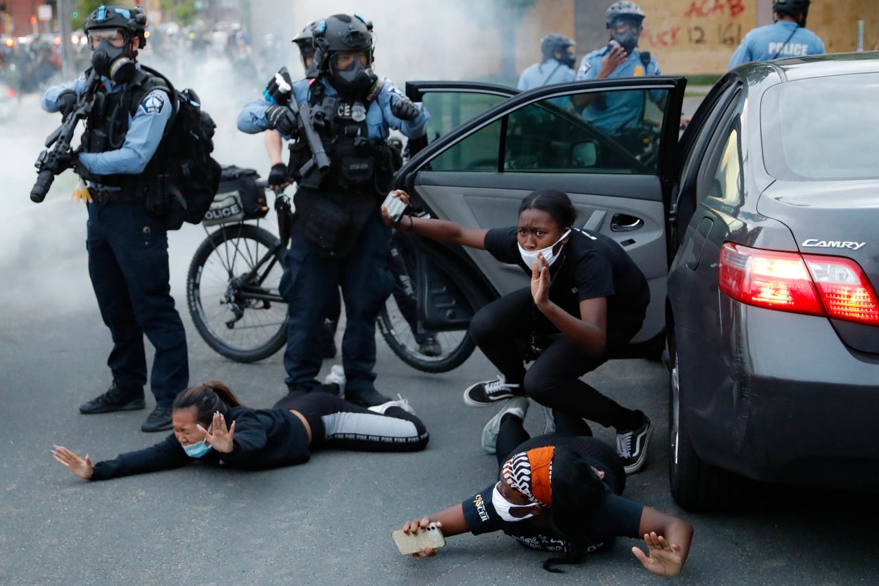 Motorists are ordered to the ground by police during a protest in Minneapolis on May 31.