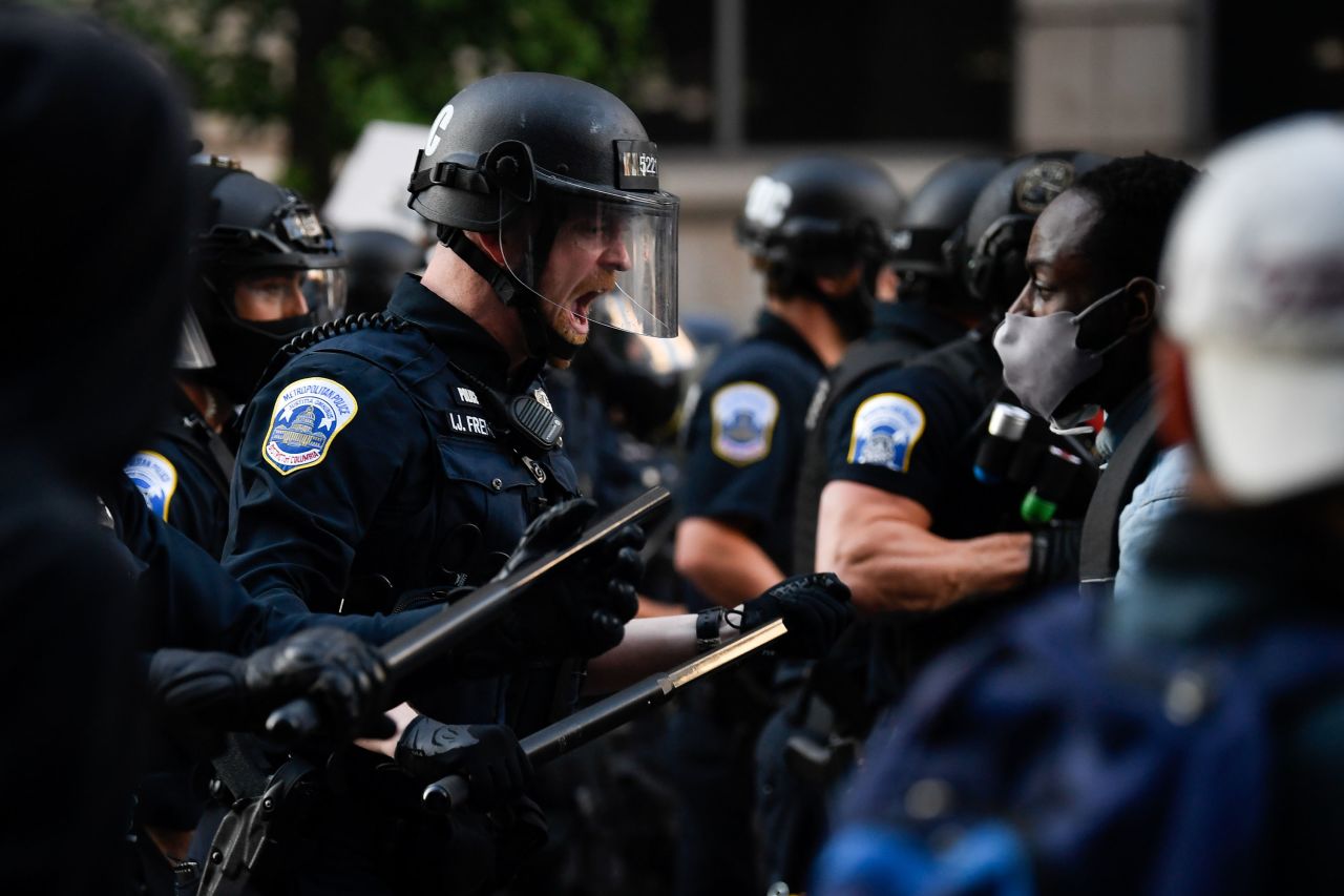 Police react to demonstrators near the White House on May 31.