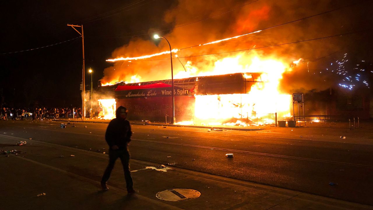 Flames rise from a liquor store near the Third Police Precinct on May 28, 2020 in Minneapolis, Minnesota, during a protest over the death of George Floyd.