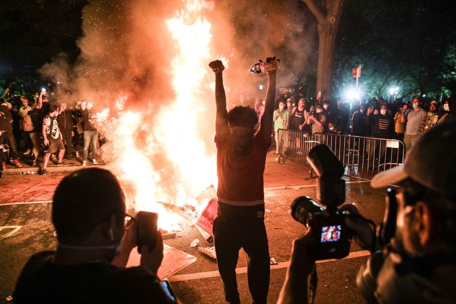 Protesters burn materials during a protest in Washington, DC, early on June 1.