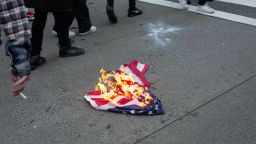 A U.S. flag burns outside of Bellevue Square Mall during protests on May 31 in Bellevue, Washington. 