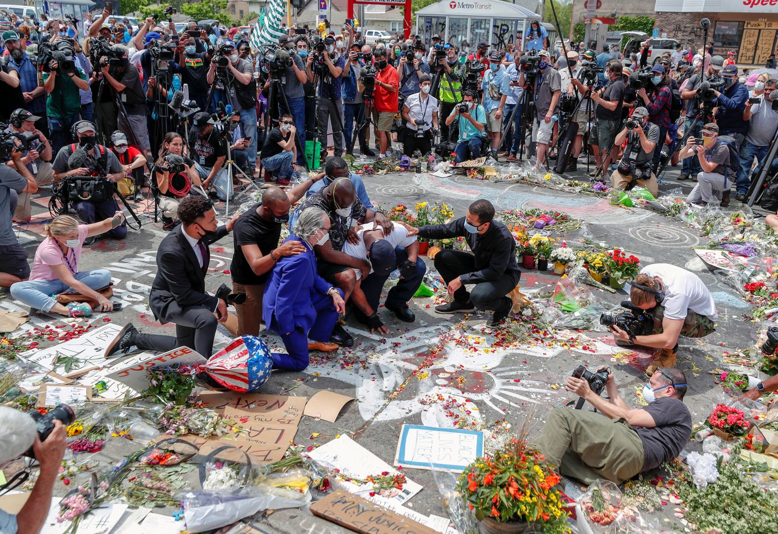 Terrence Floyd, George Floyd's brother, visits a makeshift memorial in Minneapolis on June 1. "He was barely able to walk," <a href="index.php?page=&url=https%3A%2F%2Fedition.cnn.com%2Fus%2Flive-news%2Fgeorge-floyd-protests-06-01-20%2Fh_690d6bc556ead69820461eb73afc87bc" target="_blank">CNN's Sara Sidner reported.</a> "He had to have two people on either side of him holding him up as he tried to make his way to the spot." He later spoke to the crowd and <a href="index.php?page=&url=https%3A%2F%2Fedition.cnn.com%2Fus%2Flive-news%2Fgeorge-floyd-protests-06-01-20%2Fh_bef0ba5c9f3ab227784f186ca7657d61" target="_blank">called for peace.</a>