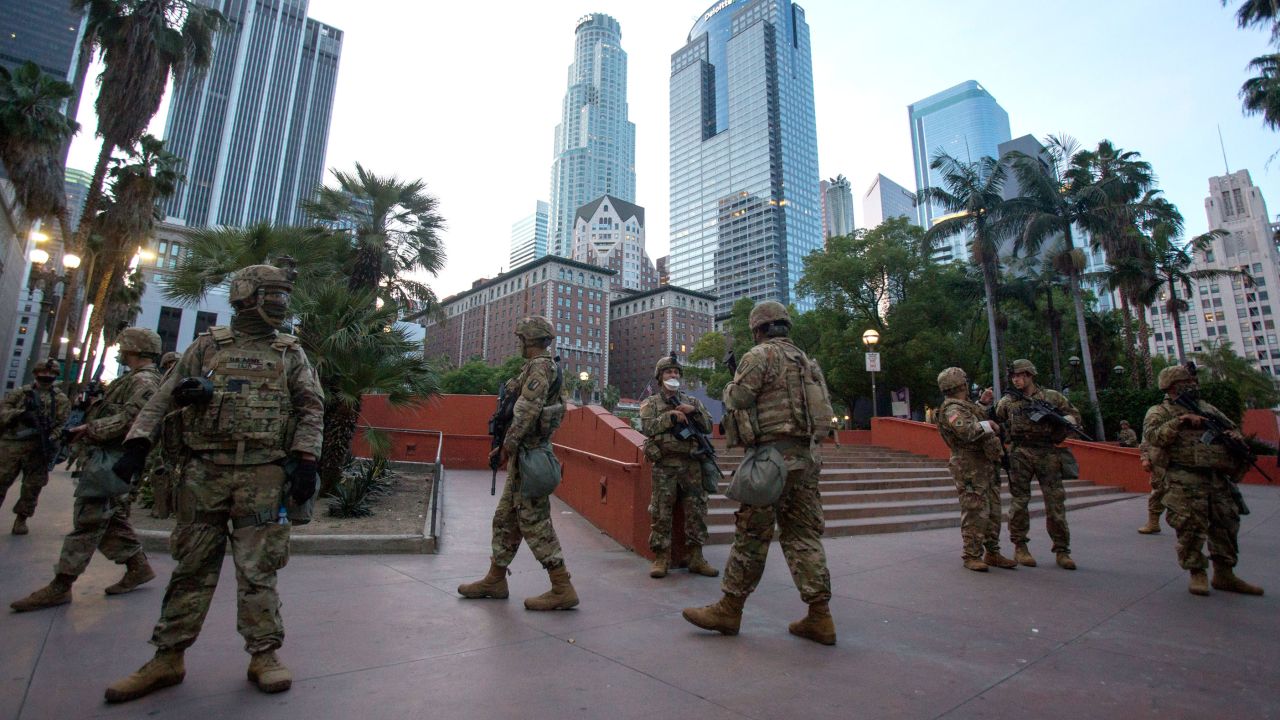 Members of California National Guard patrol, Sunday, May 31, 2020, in Los Angeles.