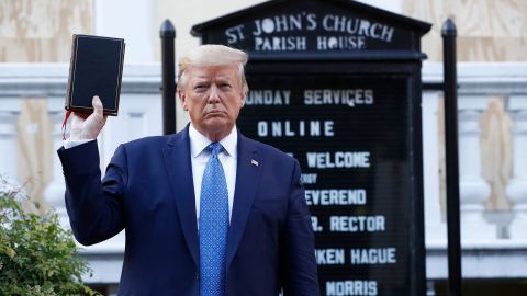 President Donald Trump holds a Bible as he visits outside St. John's Church across Lafayette Park from the White House Monday, June 1, 2020.