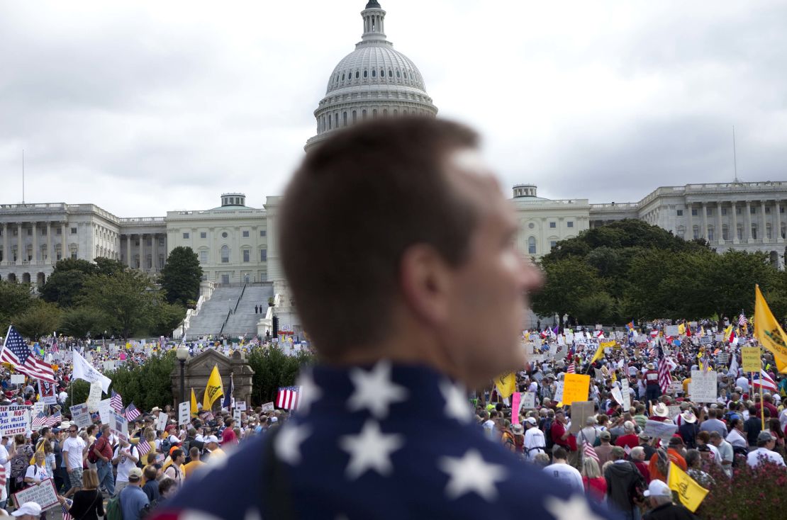 Protesters gather on Capitol Hill during the Tea Party Express rally on September 12, 2009, in Washington, DC.  Thousands of protesters gathered in Washington to march to the Capitol Hill to protest high spending, higher taxes and the growth of the federal government. 