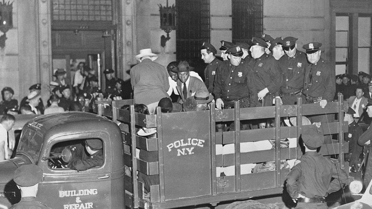 Suspects in a Harlem "race riot" were driven to jail in August 1943.
