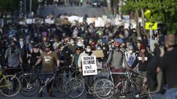 Protesters form a bicycle line as they protest the death of George Floyd in the Capitol Hill neighborhood of Seattle, Washington on June 1, 2020. - Major US cities -- convulsed by protests, clashes with police and looting since the death in Minneapolis police custody of George Floyd a week ago -- braced Monday for another night of unrest. More than 40 cities have imposed curfews after consecutive nights of tension that included looting and the trashing of parked cars. (Photo by Jason Redmond / AFP) (Photo by JASON REDMOND/AFP via Getty Images)