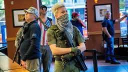A group of about 11 mostly-armed demonstrators protesting the stay-at-home order marched around downtown Raleigh and ordered sandwiches at a Subway, Saturday morning, May 9, 2020.