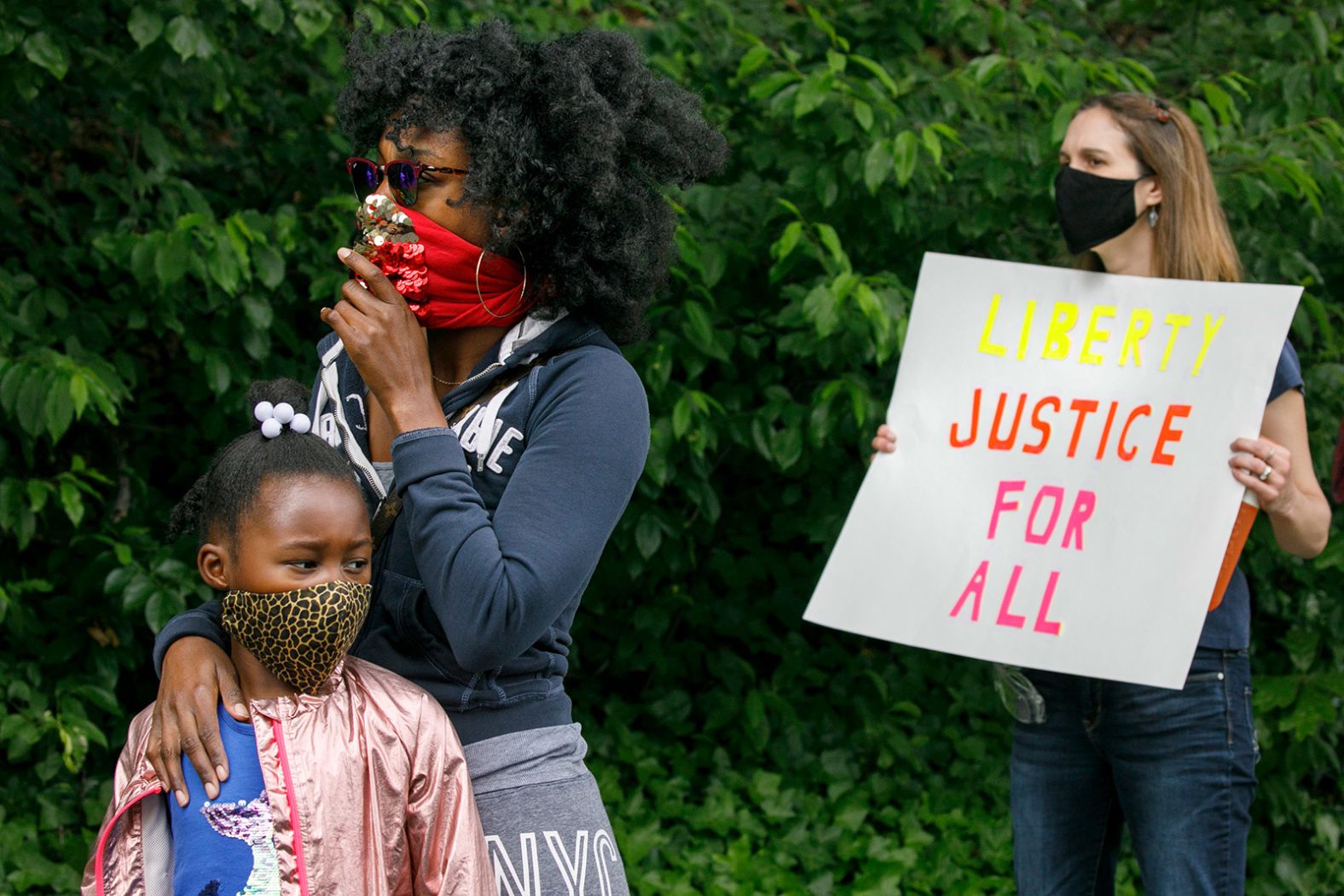 Ericka Ward-Audena stands with her 7-year-old daughter, Elle, during a protest in Washington, DC, on June 2. "I wanted my daughter to see the protests," she said. "It's really important. I've gotten a million questions from her because of it."