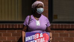 A nursing home worker participates in a vigil outside of the Downtown Brooklyn Nursing and Rehabilitation Center on May 21, 2020 in the Brooklyn borough in New York City. Nursing home workers are advocating for hazard pay, better access to personal protective equipment and respect from their employers, said a representative from the Healthcare Workers Union. (Photo by Stephanie Keith/Getty Images)
