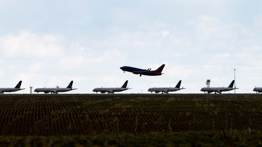 A Southwest Airlines flight takes off as United Airlines planes sit parked on a runway at Denver International Airport as the coronavirus pandemic slows air travel on April 22, 2020 in Denver, Colorado. Compared to the same time last year, Denver International Airport is operating 1,000 fewer flights daily. (Photo by Michael Ciaglo/Getty Images)
