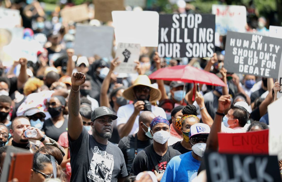 People join George Floyd's relatives in a march in Houston.