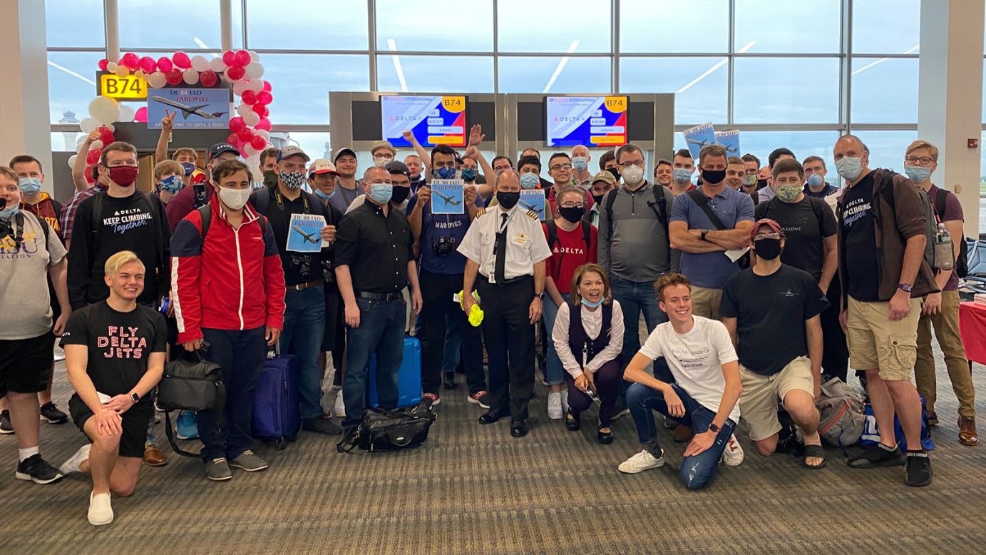 <strong>Class photo: </strong>Those aboard the last flight from Washington Dulles to Atlanta's Hartsfield-Jackson International Airport gathered for a photo at Dulles.