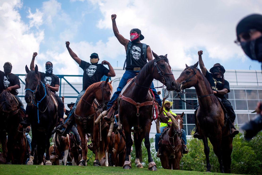 Protesters march in  downtown Houston.