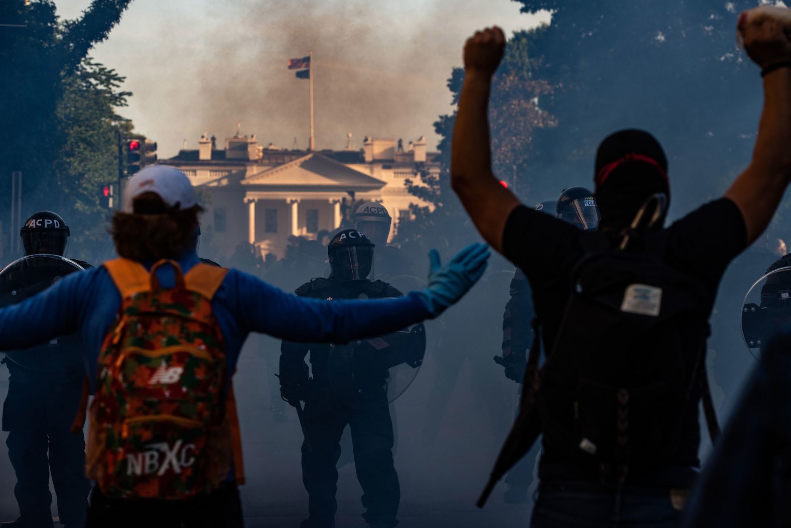 Security forces push protesters away from the White House in order to allow President Trump to make a visit to a nearby church on June 1.