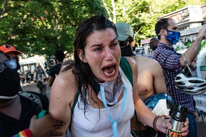 A woman cries out after being exposed to tear gas near the White House on June 1. Thousands of people were peacefully protesting near Lafayette Park when police started to shoot rubber bullets, tear gas and flash bangs into the crowd. They were clearing the block to allow President Donald Trump to walk to St. John's Episcopal Church for <a href="index.php?page=&url=https%3A%2F%2Fwww.cnn.com%2Fvideos%2Fpolitics%2F2020%2F06%2F02%2Fmariann-budde-bishop-st-johns-trump-bible-photo-ac360-vpx.cnn" target="_blank">a photo op.</a>
