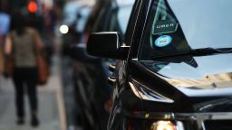 An Uber SUV waits for a client in Manhattan a day after it was announced that Uber co-founder Travis Kalanick will take a leave of absence as chief executive on June 14, 2017 in New York City. The move came after former attorney general Eric H. Holder Jr. and his law firm, Covington & Burling, released 13 pages of recommendations compiled as part of an investigation of sexual harassment at the ride-hailing car service. 