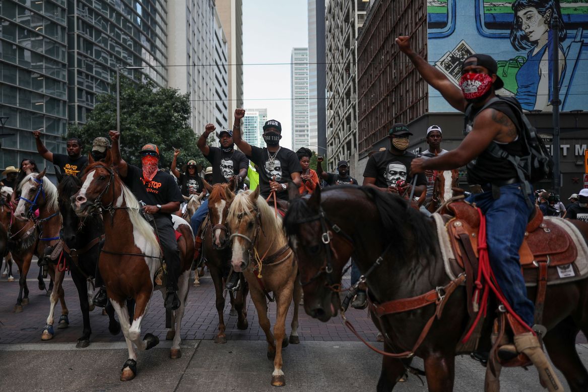 Protesters on horseback rally in downtown Houston on Tuesday, June 2. Houston is the city that George Floyd called home.