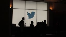 Employees walk past a lighted Twitter log as they leave the company's headquarters in San Francisco on August 13, 2019. - Twitter on August 13 said that by the end of the year users will be able to follow a small number of interests the same way they follow people. The feature will be rolled out internationally as the one-to-many messaging platform makes a priority of being an online venue for conversations rather than a pulpit for one-way broadcasting to the masses. (Photo by Glenn CHAPMAN / AFP)        (Photo credit should read GLENN CHAPMAN/AFP via Getty Images)